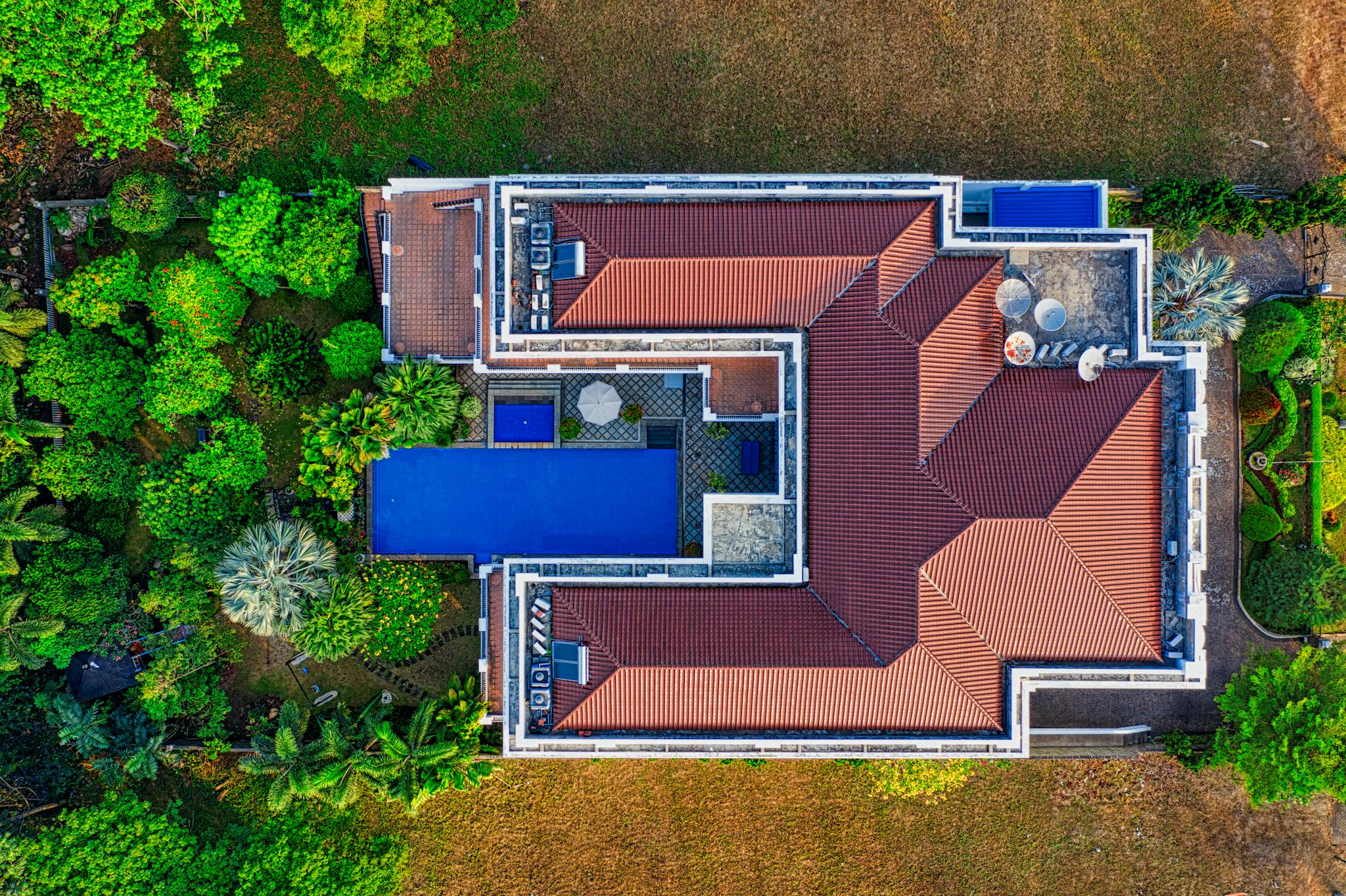 Top-down aerial view of a house in Banten, Indonesia, surrounded by greenery.